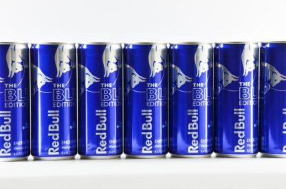 six cans of red bull energy drink lined up